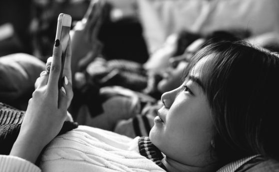 Teenage girl uses smartphone