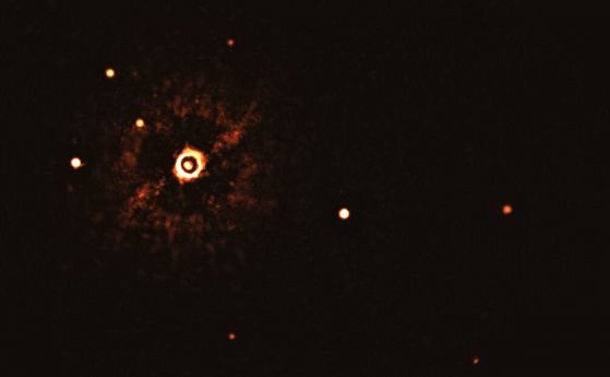 Първо изображение на многопланетна система около звезда, подобна на Слънцето
