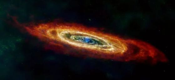 Това изображение на галактиката Андромеда, или М31, включва данни от мисията Herschel на Европейската космическа агенция (ЕКА), допълнени с данни от излязлата от експлоатация обсерватория "Планк" на ЕКА и две излезли от употреба мисии на НАСА: Infrared Astronomical Satellite (IRAS) и Cosmic Background Explorer (COBE). Комбинирането на наблюденията на "Хершел" с данни от други обсерватории създава по-пълна картина на праха в галактиката. На изображението червеният цвят показва водороден газ, зеленият - студен прах, а по-топлият прах е показан в синьо. Изстрелян през 1983 г., IRAS е първият космически телескоп, който открива инфрачервена светлина, като създава предпоставки за бъдещи обсерватории като космическия телескоп "Спицър" на НАСА и космическия телескоп "Джеймс Уеб". Обсерваторията "Планк", изстреляна през 2009 г., и COBE, изстреляна през 1989 г., изследваха космическия микровълнов фон, или светлината, останала от Големия взрив. Червеното показва водороден газ, открит с помощта на телескопа Green Bank в Западна Вирджиния, радиотелескопа Westerbork Synthesis в Нидерландия и 30-метровия телескоп на Института за радиоастрономия в милиметровия диапазон в Испания.