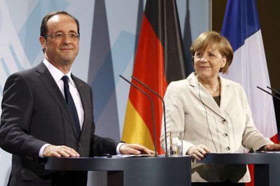 Първата среща в чужбина на новия френски президент Оланд беше с германския канцлер Ангела Меркел.