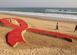 Червена панделка е символът на борбата със СПИН.