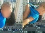 Мъж провеси бебе от 15-ия етаж, за да събира лайкове