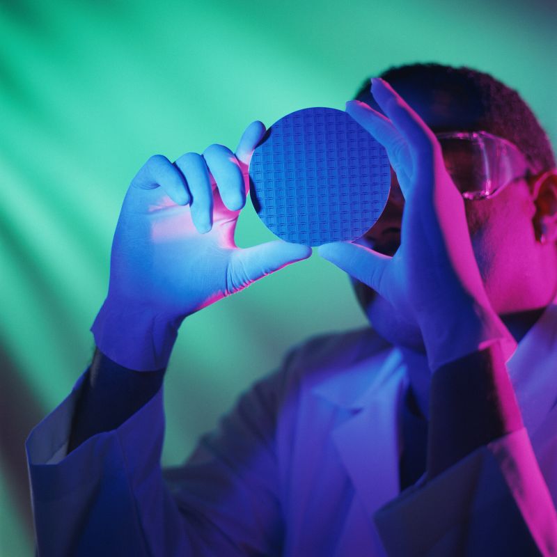 Chip engineer handling a wafer