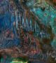 Изображение, направено с камерата HiRISE, с фалшиви цветове, показващо фините цветови разлики на Марс - минерали, свързани с базалтови потоци лава в синьо, а останалите цветове отбелязват минерали като пироксени и глини.  